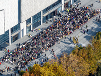 Customers line up in front of a Pangdonglai (DL) store in Xuchang, China, on December 7, 2024. (