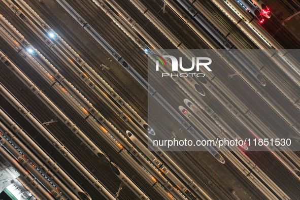 Emu trains are parked at the Nanjing South Bullet Train station in Nanjing, China, on December 10, 2024. 