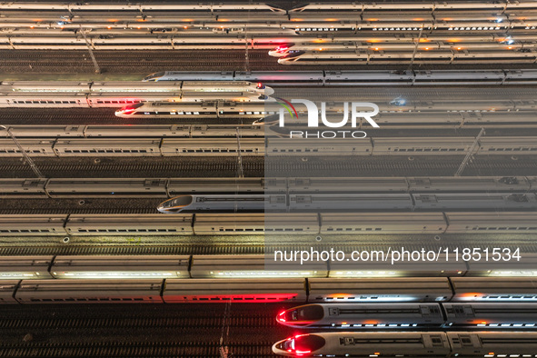 Emu trains are parked at the Nanjing South Bullet Train station in Nanjing, China, on December 10, 2024. 