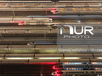 Emu trains are parked at the Nanjing South Bullet Train station in Nanjing, China, on December 10, 2024. (