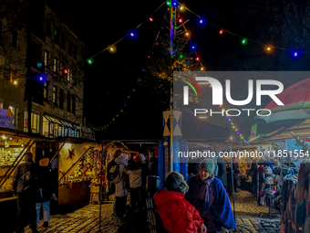 The Neuhauser Christmas Market at Rotkreuzplatz in Munich, Bavaria, Germany, on December 9, 2024, offers a welcoming and relaxed atmosphere,...