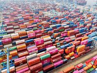 Foreign trade containers are piled up at a fully-automated terminal at Qingdao Port in Shandong province in Qingdao, China, on December 10,...