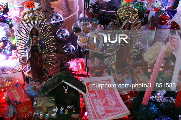 Two figures of the Virgin of Guadalupe and various items for the Christmas season and the Posadas are at a stand installed in the Tlalpan Ce...