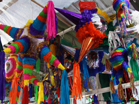 Different pinatas are seen at a tianguis, where various items are sold for the Christmas season and the posadas, in the Tlalpan Center in Me...