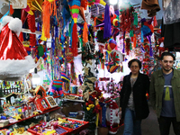 People attend a market where different items are sold for the Christmas and Posadas season in the Tlalpan Center in Mexico City, Mexico, on...