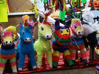 Different pinatas are seen at a tianguis, where various items are sold for the Christmas season and the posadas, in the Tlalpan Center in Me...