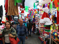 People attend a market where different items are sold for the Christmas and Posadas season in the Tlalpan Center in Mexico City, Mexico, on...