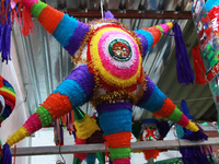 A pinata is seen at a tianguis, where different items are sold for the Christmas season and the posadas, in the Tlalpan Center in Mexico Cit...