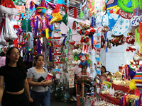 People attend a market where different items are sold for the Christmas and Posadas season in the Tlalpan Center in Mexico City, Mexico, on...