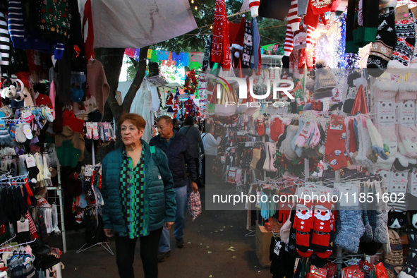 People attend a market where different items are sold for the Christmas and Posadas season in the Tlalpan Center in Mexico City, Mexico, on...