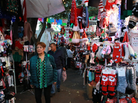 People attend a market where different items are sold for the Christmas and Posadas season in the Tlalpan Center in Mexico City, Mexico, on...