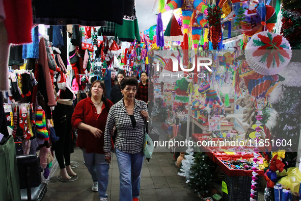 People attend a market where different items are sold for the Christmas and Posadas season in the Tlalpan Center in Mexico City, Mexico, on...