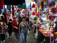 People attend a market where different items are sold for the Christmas and Posadas season in the Tlalpan Center in Mexico City, Mexico, on...