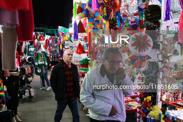 People attend a market where different items are sold for the Christmas and Posadas season in the Tlalpan Center in Mexico City, Mexico, on...