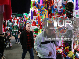 People attend a market where different items are sold for the Christmas and Posadas season in the Tlalpan Center in Mexico City, Mexico, on...