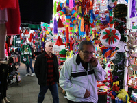 People attend a market where different items are sold for the Christmas and Posadas season in the Tlalpan Center in Mexico City, Mexico, on...