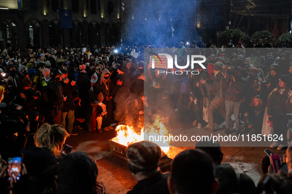 Anti-government demonstrators gather outside the parliament for a twelfth consecutive day of mass protests against the government's postpone...