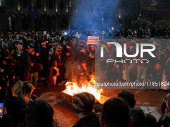 Anti-government demonstrators gather outside the parliament for a twelfth consecutive day of mass protests against the government's postpone...