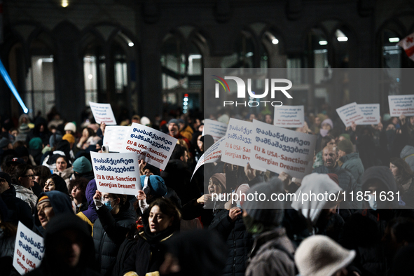 Anti-government demonstrators gather outside the parliament for a twelfth consecutive day of mass protests against the government's postpone...