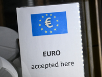 A sign reading 'Euro accepted here' is seen in Warsaw, Poland on 09 December, 2024. (