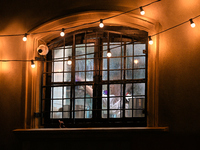 A cook is seen in a restaurant kitchen through a window in Warsaw, Poland on 09 December, 2024. (