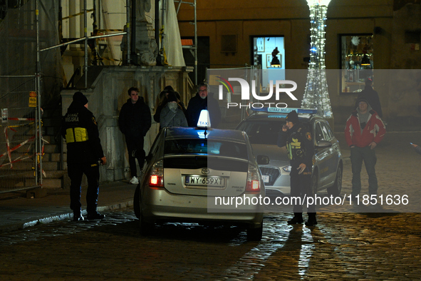 City guards or Straz Miejska is seen stopping a taxi driver in Warsaw, Poland on 09 December, 2024. 