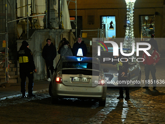 City guards or Straz Miejska is seen stopping a taxi driver in Warsaw, Poland on 09 December, 2024. (