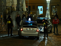 City guards or Straz Miejska is seen stopping a taxi driver in Warsaw, Poland on 09 December, 2024. (