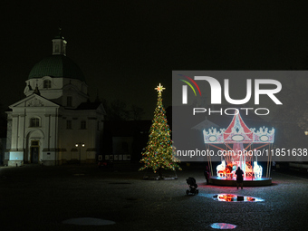 Illuminated Christmas decorations and caroussels are seen in Warsaw, Poland on 09 December, 2024. (