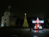 Illuminated Christmas decorations and caroussels are seen in Warsaw, Poland on 09 December, 2024. (