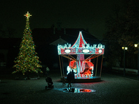 Illuminated Christmas decorations and caroussels are seen in Warsaw, Poland on 09 December, 2024. (