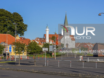 A church and lighthouse are seen in Ronne, Bornholm Island, Denmark, on August 6, 2024. (