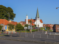 A church and lighthouse are seen in Ronne, Bornholm Island, Denmark, on August 6, 2024. (