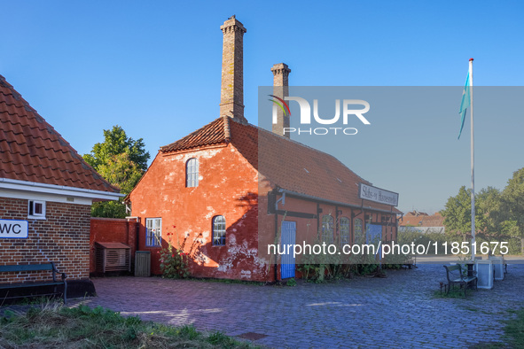 An old red building in the port is seen in Ronne, Bornholm Island, Denmark, on August 6, 2024. 