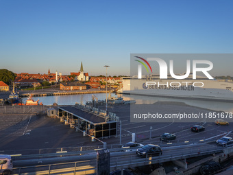 A general view of the ferry terminal in the port with a Bornholmslinjen ferry in the background is seen in Ronne, Bornholm Island, Denmark,...