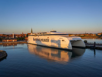 A general view of the ferry terminal in the port with a Bornholmslinjen ferry in the background is seen in Ronne, Bornholm Island, Denmark,...