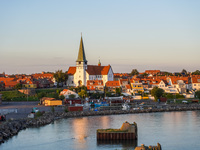 A general view of the city during the summer sunset is seen in Ronne, Bornholm Island, Denmark, on August 6, 2024. (