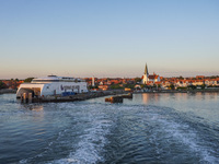 A general view of the ferry terminal in the port with a Bornholmslinjen ferry in the background is seen in Ronne, Bornholm Island, Denmark,...