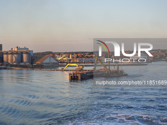 A general view of the port during sunset is seen in Ronne, Bornholm Island, Denmark, on August 6, 2024. (