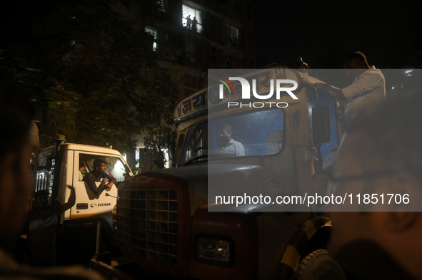 A crane driver is seen inside his crane cabin, arriving to remove the damaged BEST bus that lost control and crushed a few vehicles, injurin...