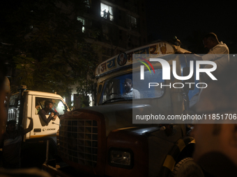 A crane driver is seen inside his crane cabin, arriving to remove the damaged BEST bus that lost control and crushed a few vehicles, injurin...