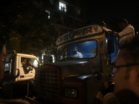 A crane driver is seen inside his crane cabin, arriving to remove the damaged BEST bus that lost control and crushed a few vehicles, injurin...