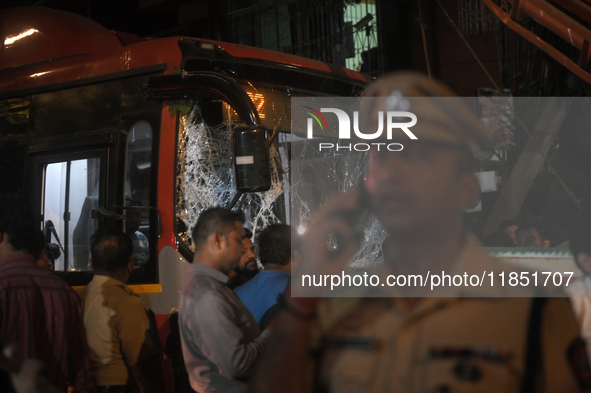 A damaged windshield is seen on a BEST bus that loses control and crushes a few vehicles, injuring 49 people and resulting in the deaths of...