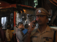 A damaged windshield is seen on a BEST bus that loses control and crushes a few vehicles, injuring 49 people and resulting in the deaths of...