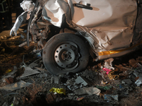 A damaged car body and tire are seen at an accident site where a BEST bus loses control and crushes a few vehicles, injuring 49 people and k...