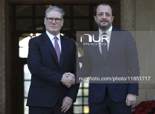 Britain's Prime Minister Keir Starmer is welcomed by Cyprus' President Nikos Christodoulides at the Presidential Palace in Nicosia, Cyprus,...