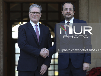 Britain's Prime Minister Keir Starmer is welcomed by Cyprus' President Nikos Christodoulides at the Presidential Palace in Nicosia, Cyprus,...