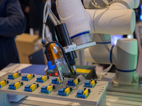 An automatic spraying robot is seen at the 2024 Global Artificial Intelligence Product Application Expo in Suzhou, China, on December 10, 20...