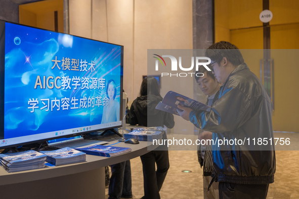 A visitor consults about AIGC products at the 2024 Global Artificial Intelligence Product Application Expo in Suzhou, China, on December 10,...