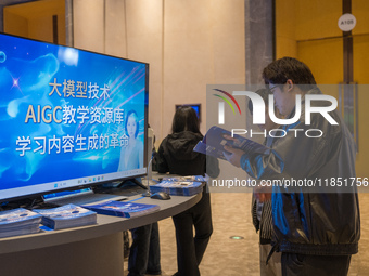 A visitor consults about AIGC products at the 2024 Global Artificial Intelligence Product Application Expo in Suzhou, China, on December 10,...